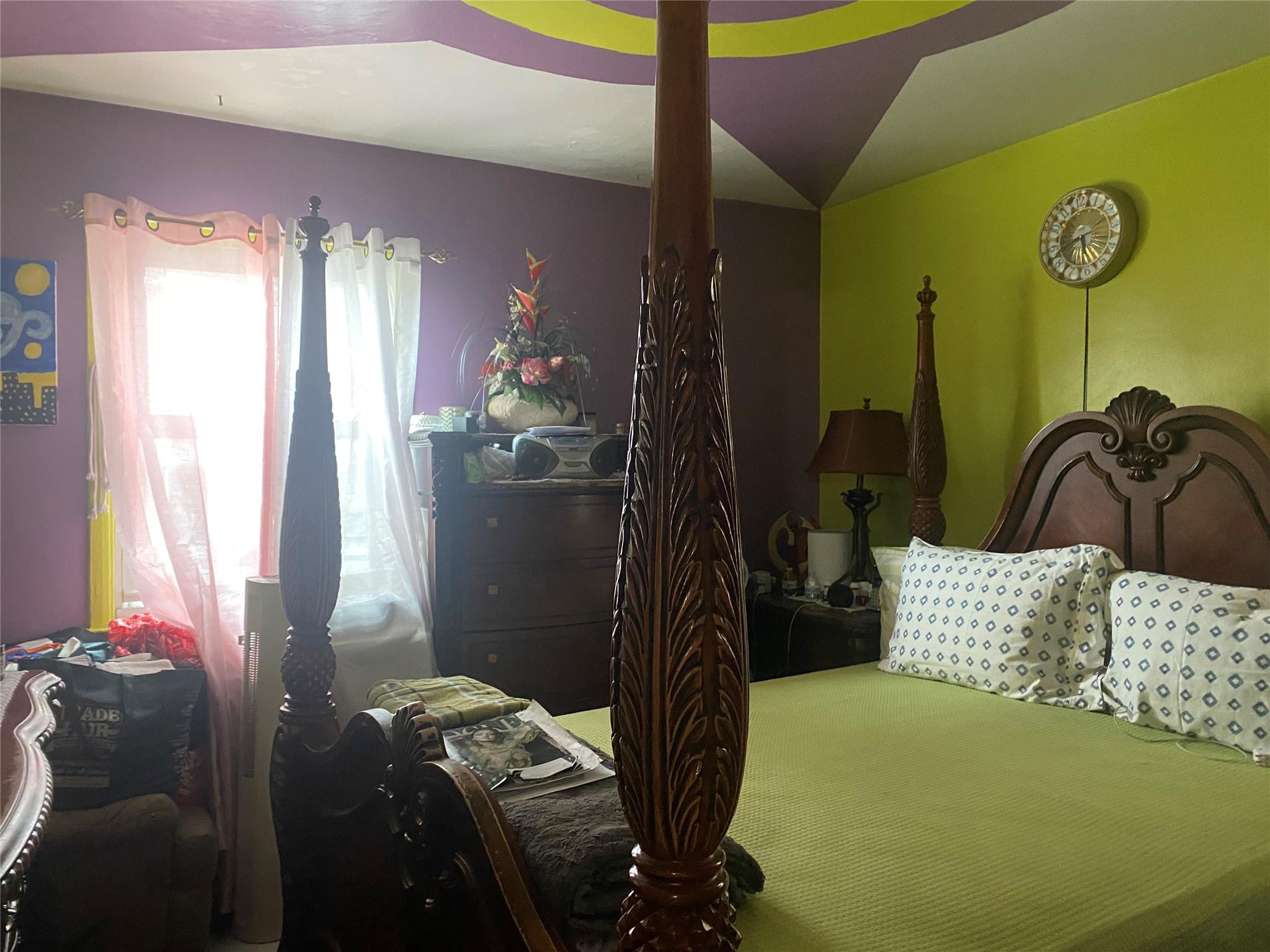 106-60 Ditmars Boulevard Queens, NY 11369 - Photo 10 of 12 a bedroom with a bed and a window