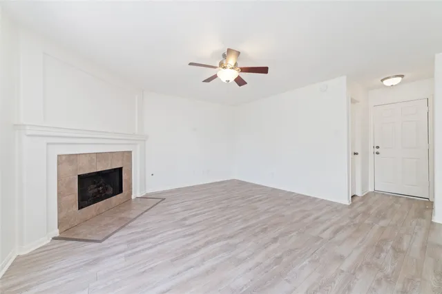 a view of empty room with fireplace