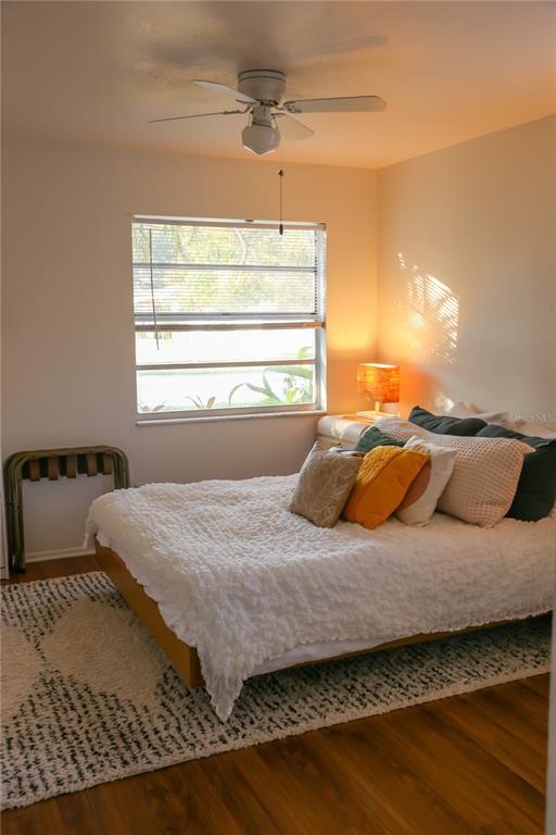 1810 Copper Kettle Lane Dunedin, FL 34698 - Photo 11 of 22 a bedroom with a bed and window