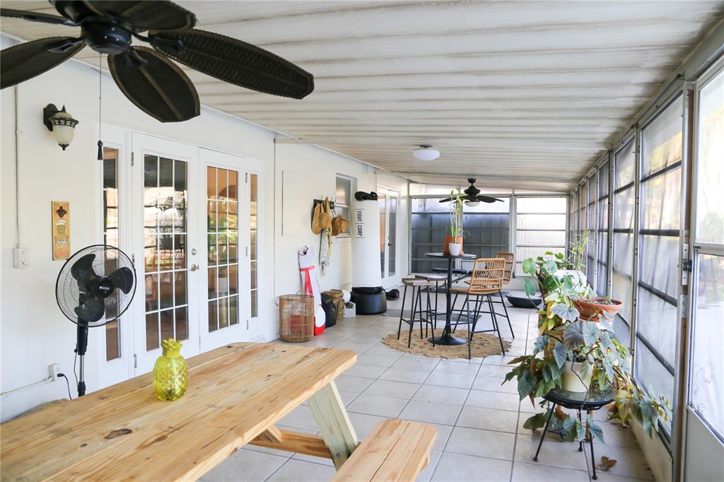 1810 Copper Kettle Lane Dunedin, FL 34698 - Photo 17 of 22 a living room with patio furniture