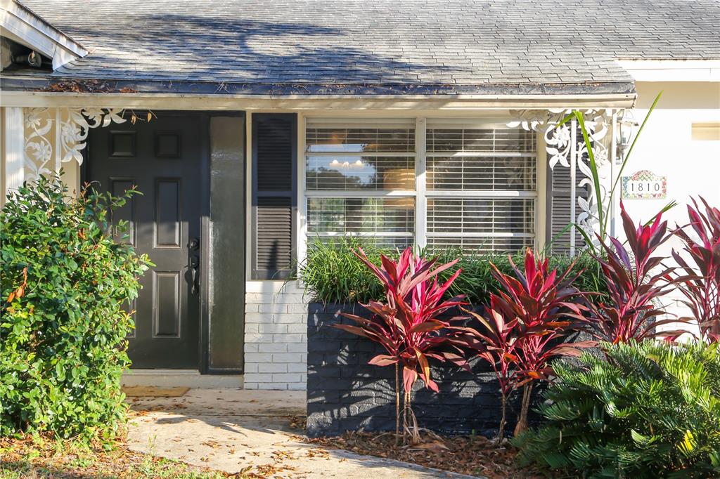 1810 Copper Kettle Lane Dunedin, FL 34698 - Photo 22 of 22 a potted plant in front of a building