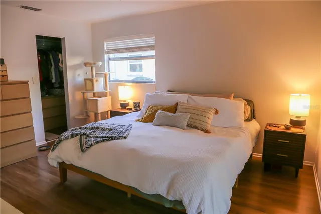 a bedroom with bed and window