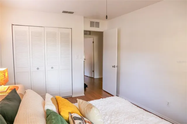 a bedroom with a bed and a walk in closet