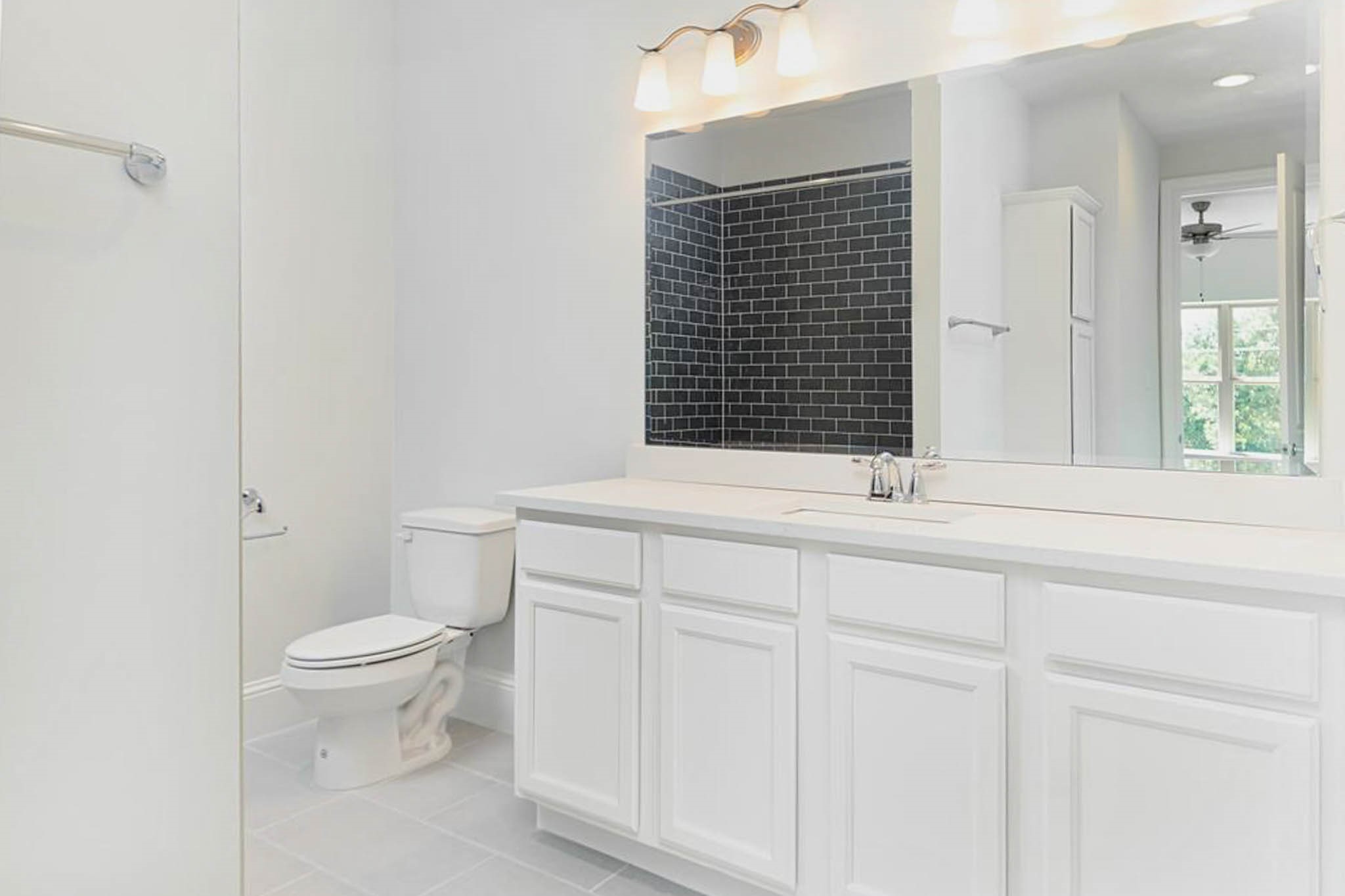 7715 South Fall Run Crossing Houston, TX 77055 - Photo 14 of 22 a bathroom with a sink and a toilet