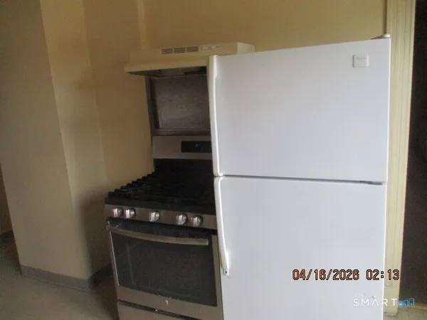 a close view of a stove and a refrigerator