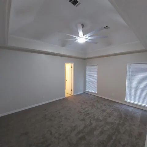 a view of an empty room with a window