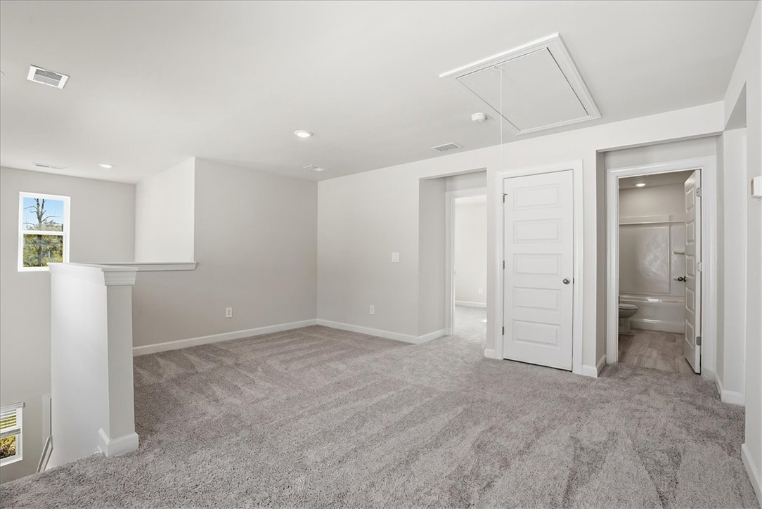 973 Penfold Pointe Point Blythewood, SC 29016 - Photo 22 of 39 This upper-level loft space offers versatile living with soft carpeting and natural light.
