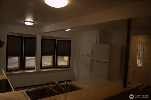 a bathroom with a sink and a window