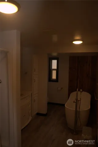 a bathroom with a toilet sink and shower