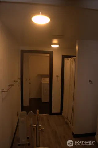 a bathroom with a bathtub and shower