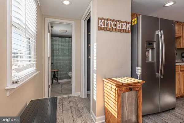 a view of a kitchen with a refrigerator and a stove