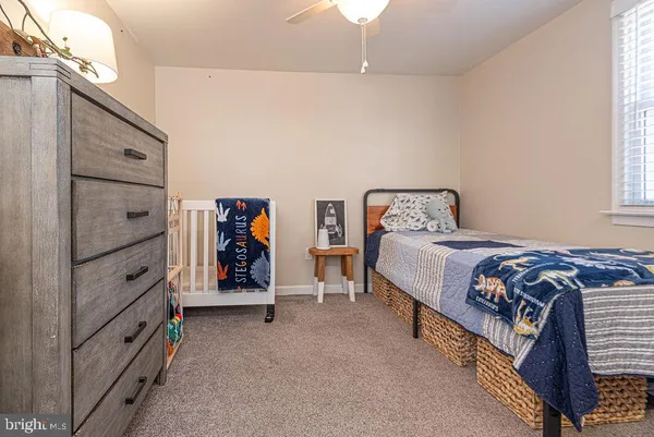 a bedroom with bed and a window