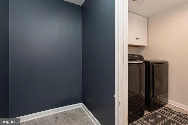 a stove top oven sitting inside of a kitchen
