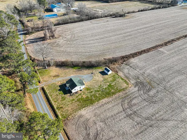 a view of a house with a yard and garage