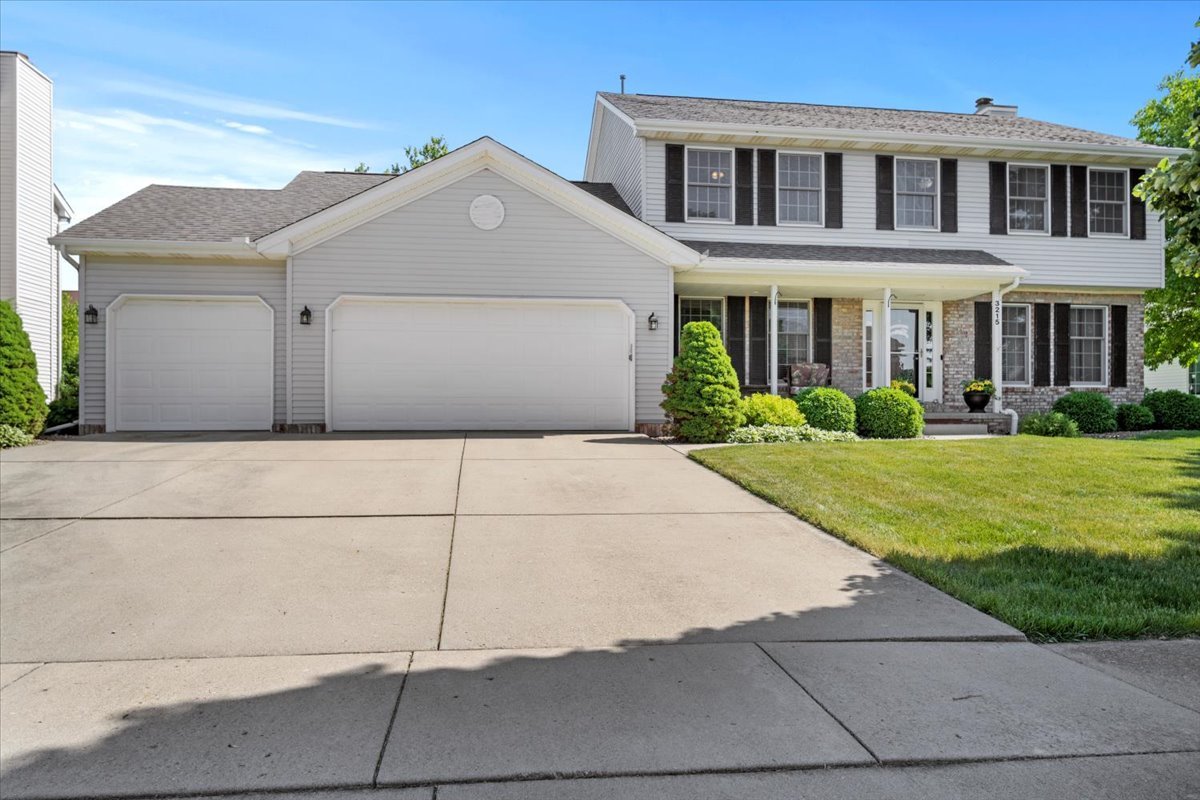 3215 Eagle Crest Road Bloomington, IL 61704 - Photo 1 of 35 a front view of a house with a yard