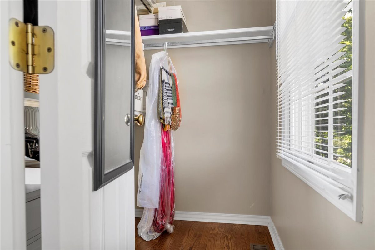 3215 Eagle Crest Road Bloomington, IL 61704 - Photo 18 of 35 a view of walk in closet with clothes and shoes