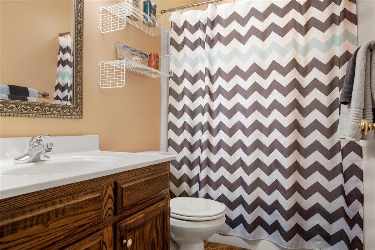 3215 Eagle Crest Road Bloomington, IL 61704 - Photo 20 of 35 a bathroom with a granite countertop sink and a toilet
