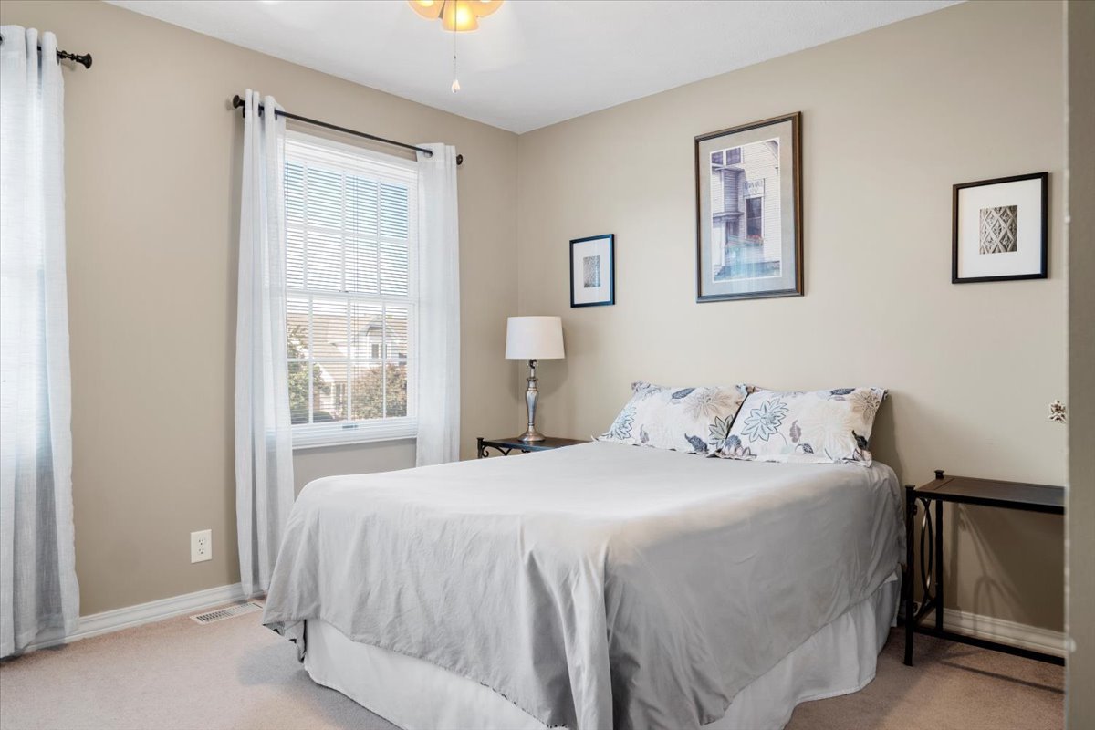 3215 Eagle Crest Road Bloomington, IL 61704 - Photo 22 of 35 a bedroom with a bed and a window