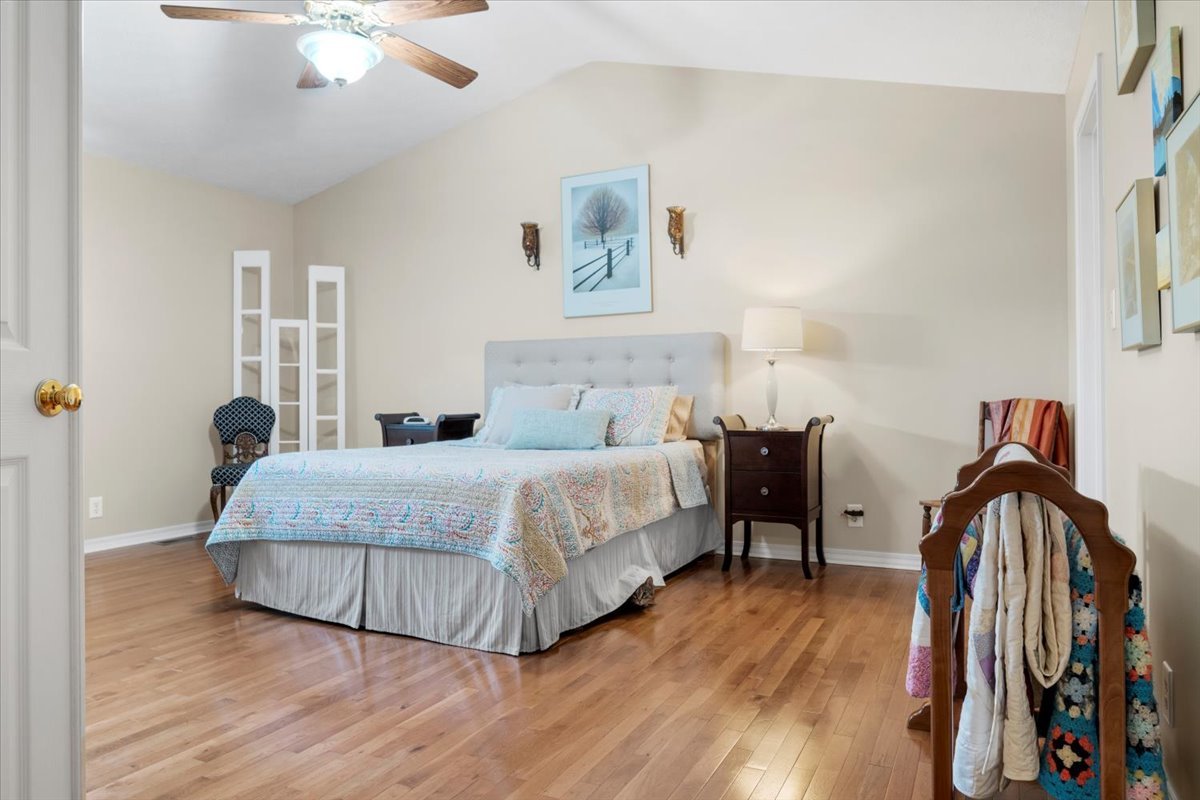 3215 Eagle Crest Road Bloomington, IL 61704 - Photo 23 of 35 a bedroom with a bed and a chandelier