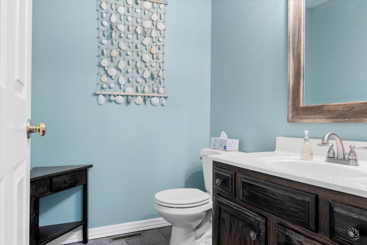 3215 Eagle Crest Road Bloomington, IL 61704 - Photo 28 of 35 a bathroom with a sink and a toilet
