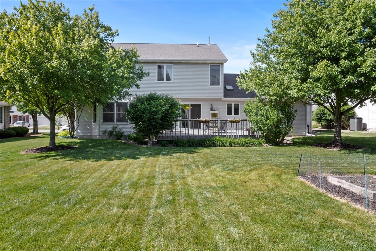3215 Eagle Crest Road Bloomington, IL 61704 - Photo 3 of 35 a front view of house with yard and trees