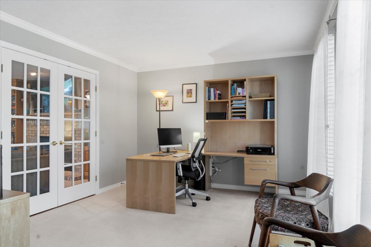 3215 Eagle Crest Road Bloomington, IL 61704 - Photo 4 of 35 a view of a workspace with furniture and a window