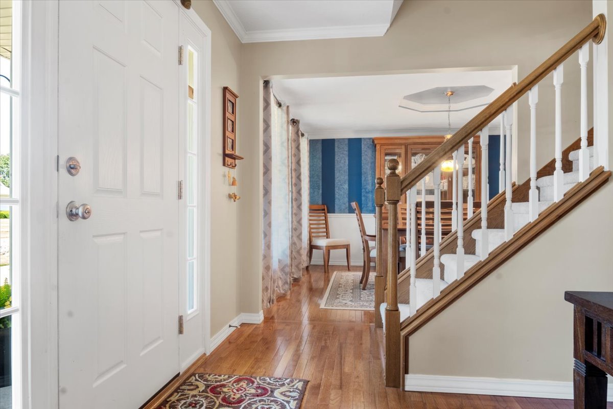 3215 Eagle Crest Road Bloomington, IL 61704 - Photo 5 of 35 a view of an entryway with wooden floor and door