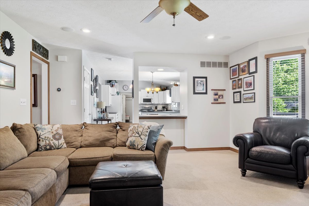 3215 Eagle Crest Road Bloomington, IL 61704 - Photo 7 of 35 a living room with furniture and a large window