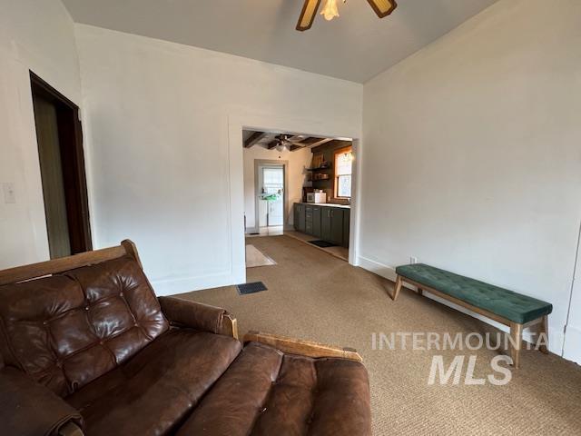 450 South 3rd E Street Mountain Home, ID 83647 - Photo 16 of 35 Living area featuring carpet floors and a ceiling fan