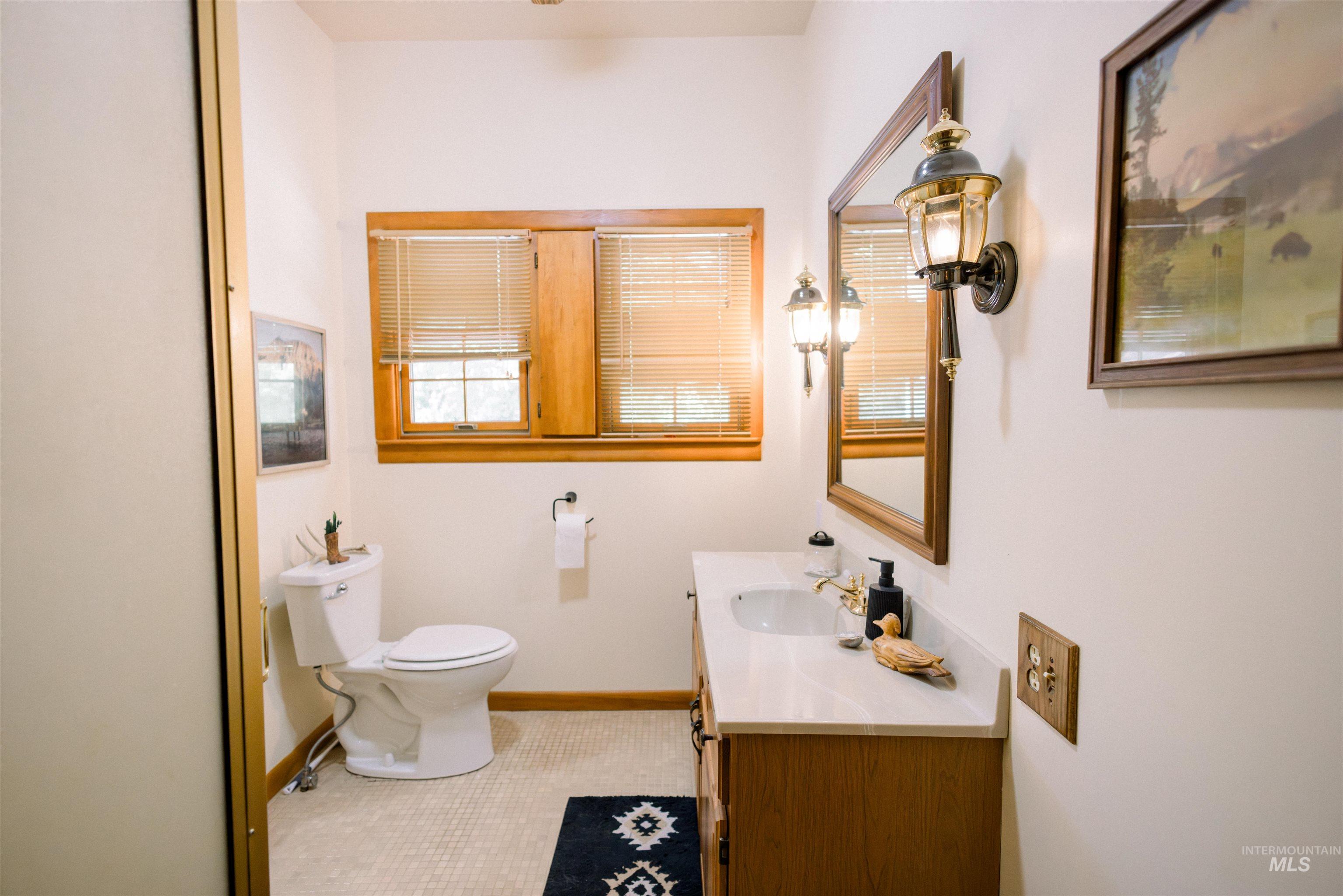 450 South 3rd E Street Mountain Home, ID 83647 - Photo 20 of 35 Bathroom with vanity and tile patterned floors