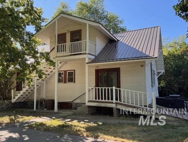 450 South 3rd E Street Mountain Home, ID 83647 - Photo 2 of 35 Rear view of property with a balcony and a metal roof