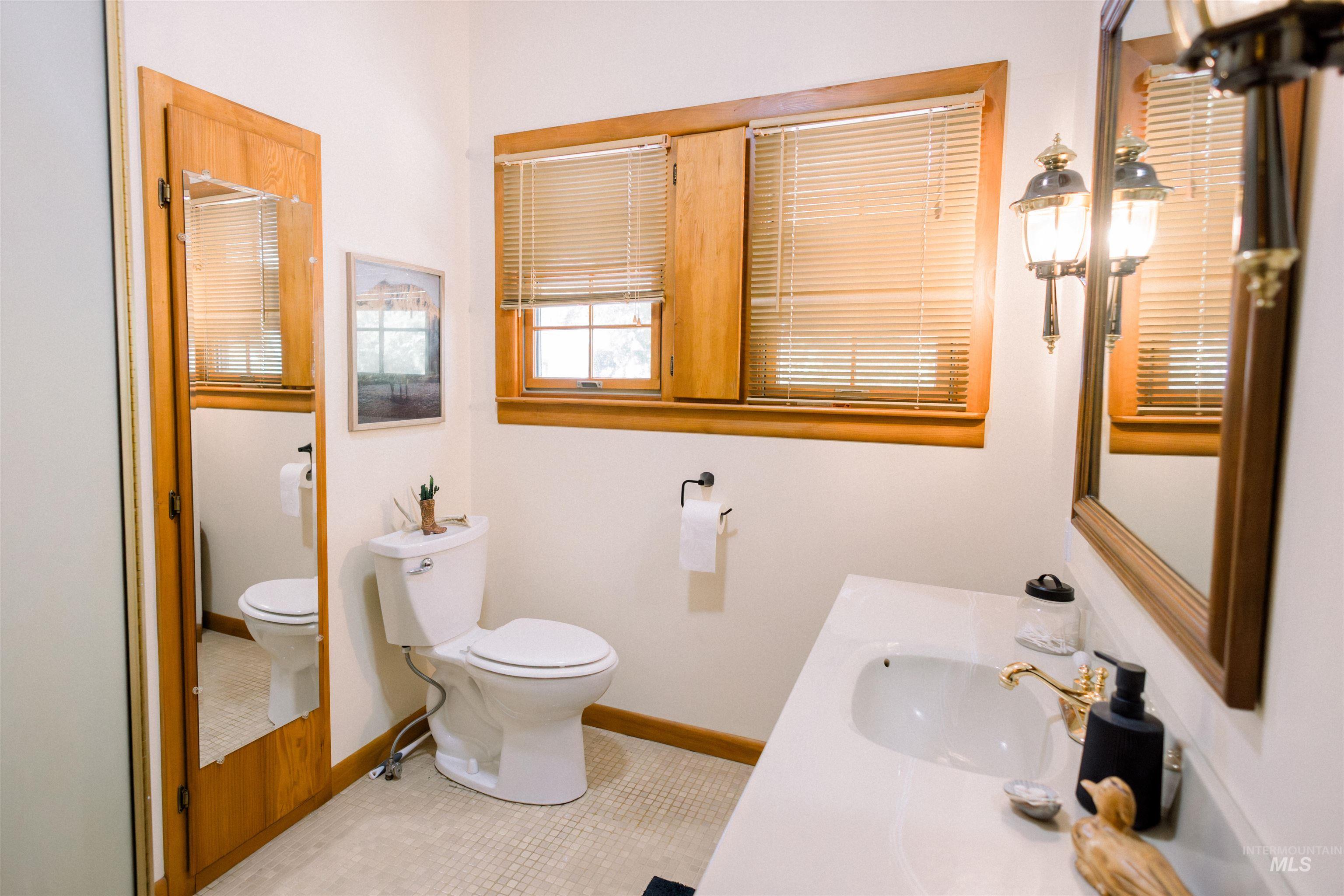 450 South 3rd E Street Mountain Home, ID 83647 - Photo 21 of 35 Bathroom with vanity and tile patterned floors