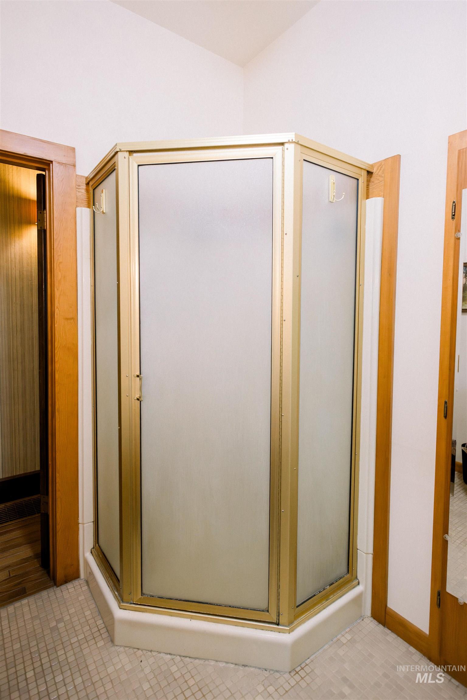 450 South 3rd E Street Mountain Home, ID 83647 - Photo 22 of 35 Bathroom with a shower stall and tile patterned floors