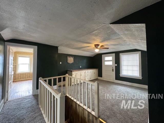 450 South 3rd E Street Mountain Home, ID 83647 - Photo 27 of 35 Hallway featuring healthy amount of natural light, carpet, and an upstairs landing