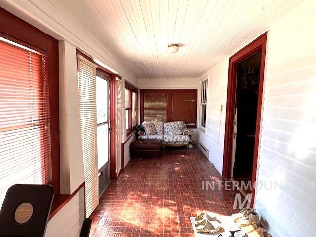 450 South 3rd E Street Mountain Home, ID 83647 - Photo 3 of 35 Fornt porch featuring a baseboard heating unit