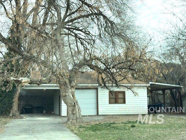 450 South 3rd E Street Mountain Home, ID 83647 - Photo 35 of 35 Garage with an attached carport and concrete driveway