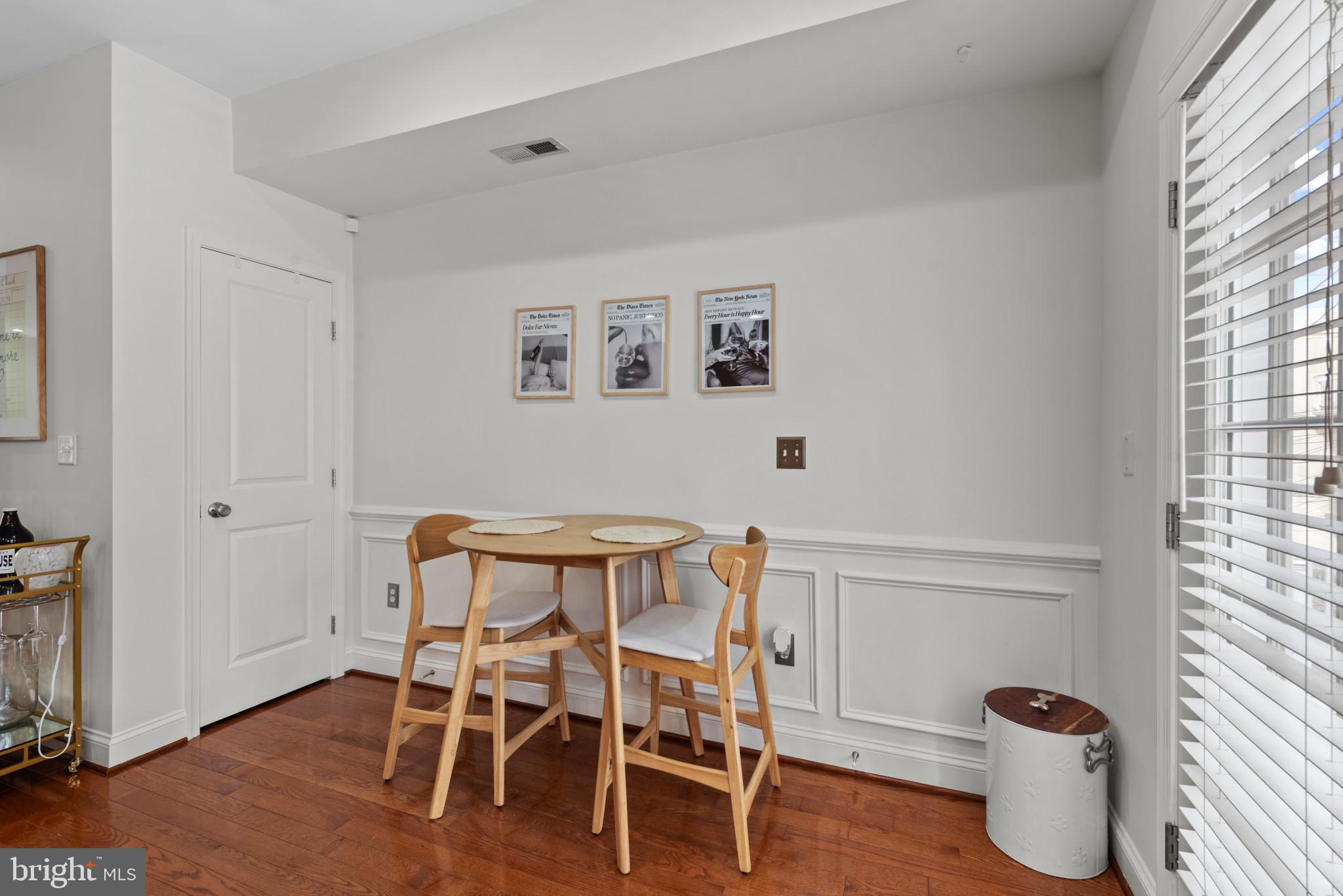 3418 Gunther Way Baltimore, MD 21224 - Photo 15 of 57 a view of a workspace with furniture and wooden floor