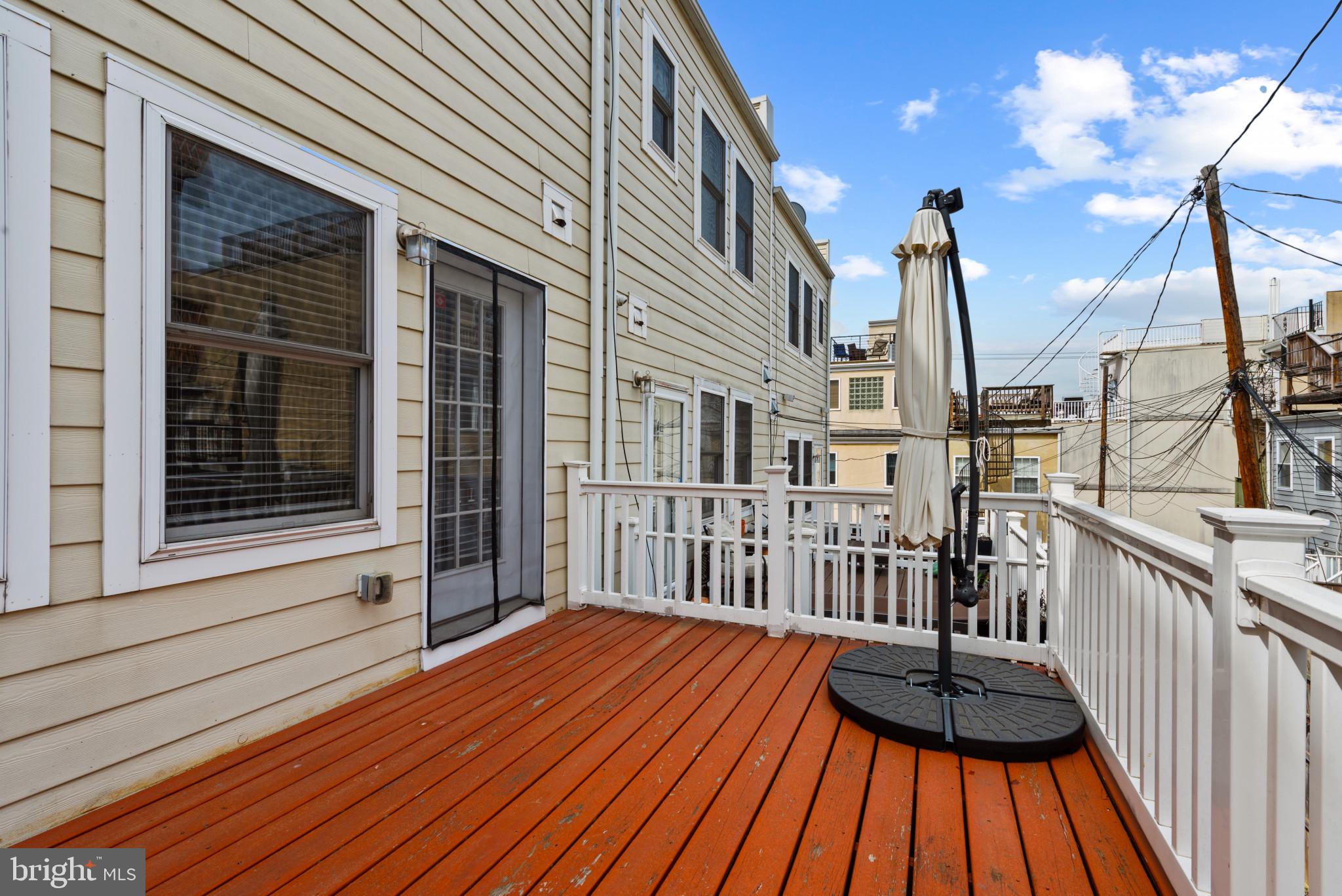3418 Gunther Way Baltimore, MD 21224 - Photo 18 of 57 a view of a wooden deck with a yard