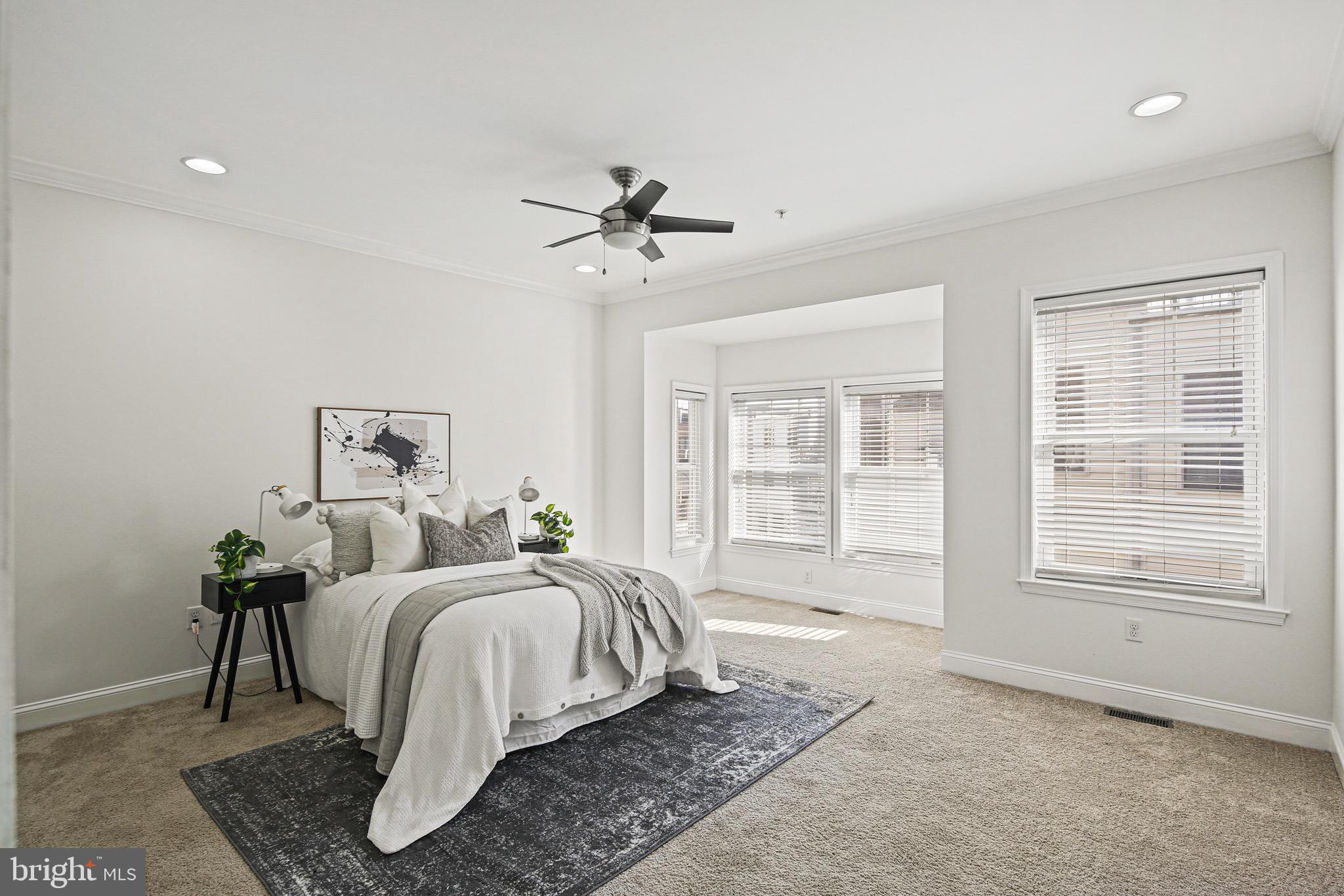3418 Gunther Way Baltimore, MD 21224 - Photo 21 of 57 a bed room with a bed a chandelier and a window