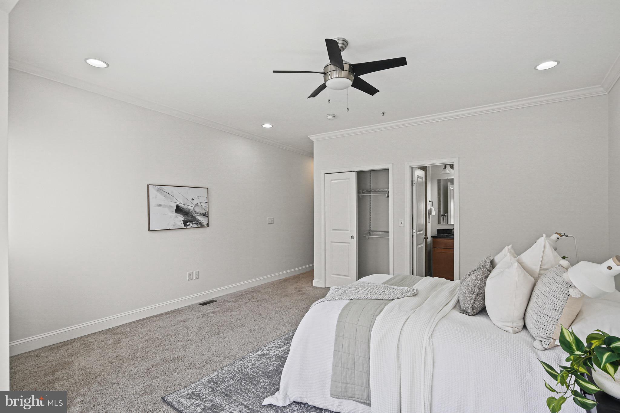 3418 Gunther Way Baltimore, MD 21224 - Photo 22 of 57 a bedroom with a bed and a painting on the wall
