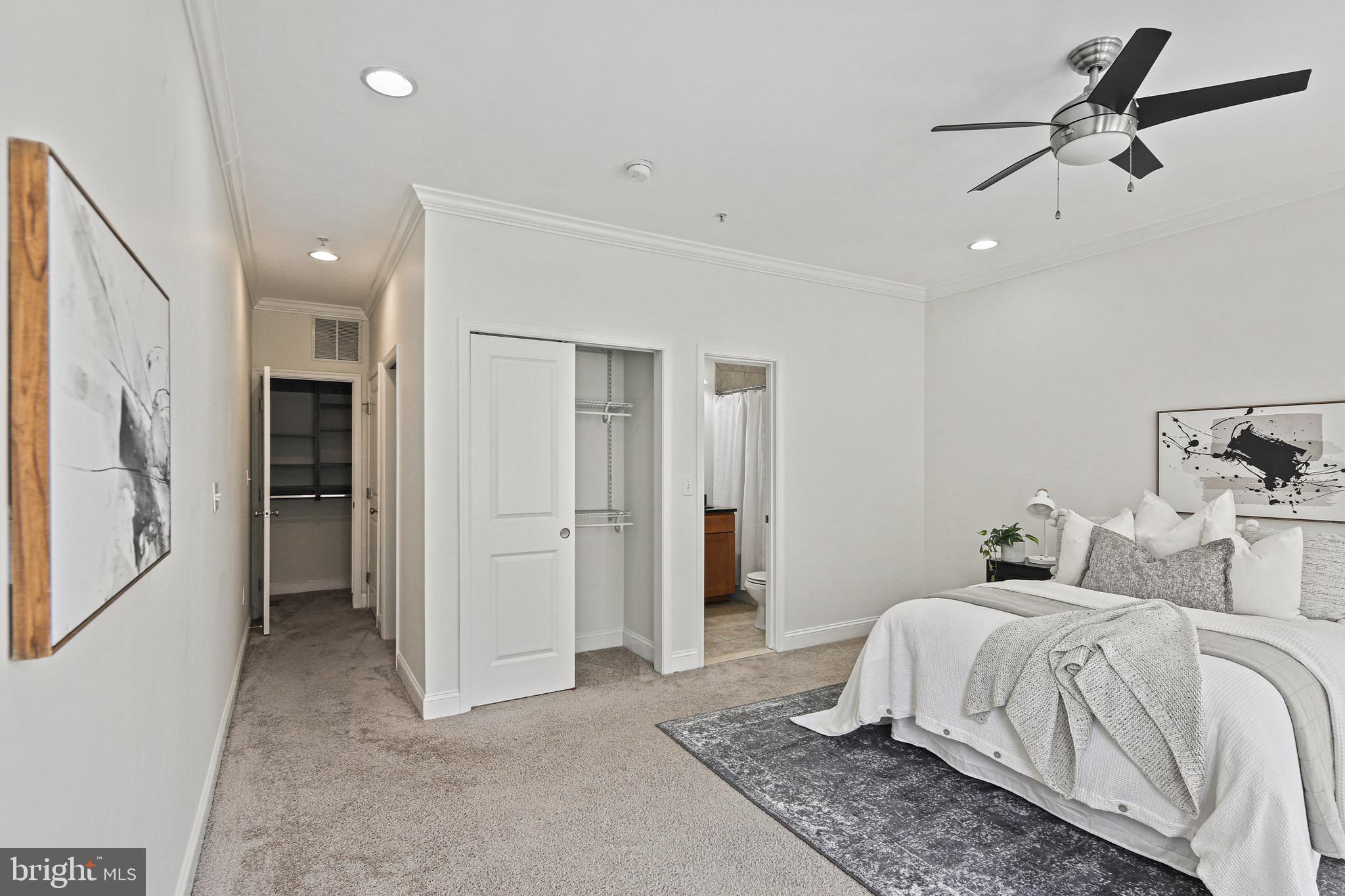 3418 Gunther Way Baltimore, MD 21224 - Photo 23 of 57 a bedroom with a large bed and chandelier