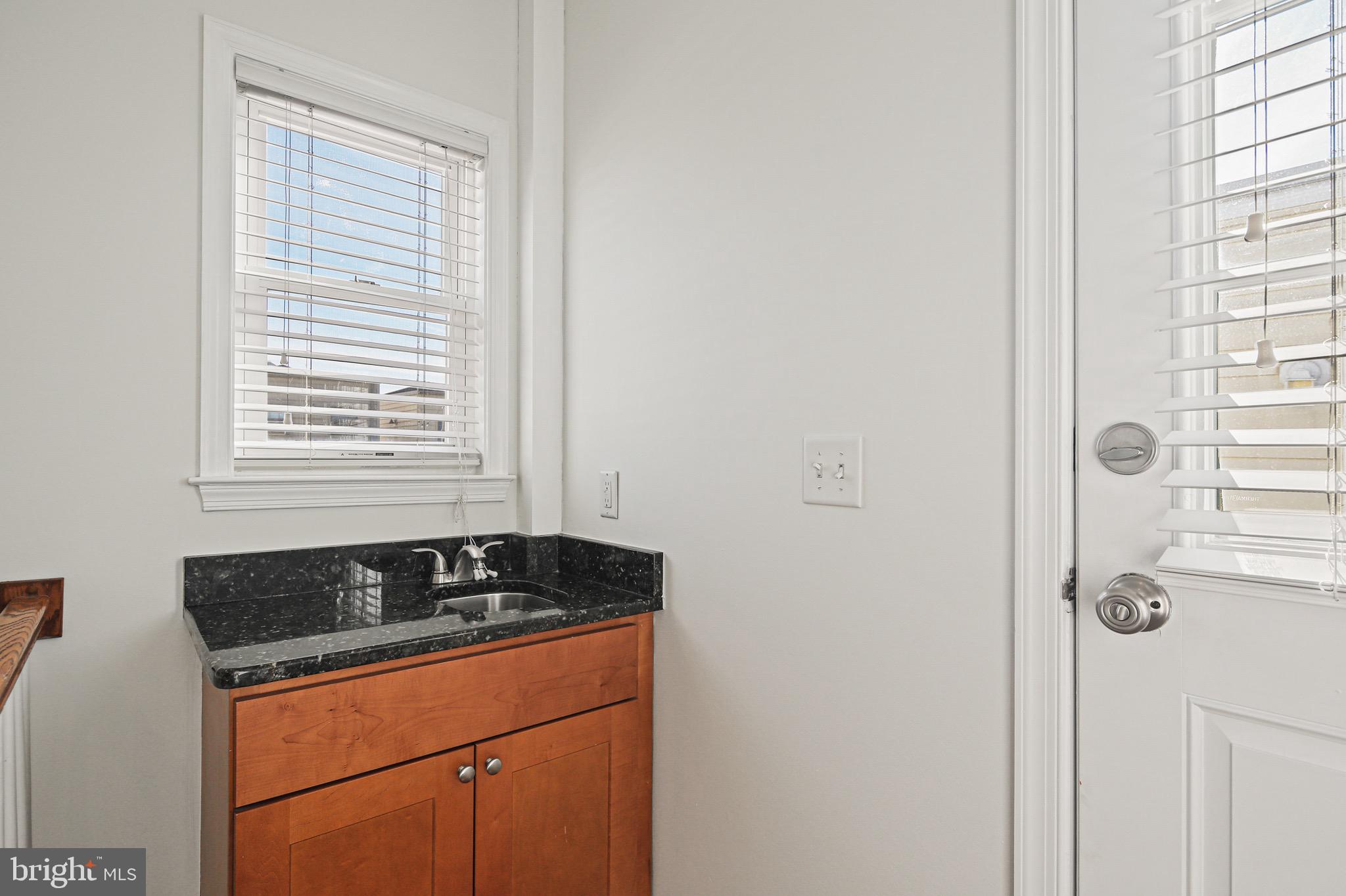 3418 Gunther Way Baltimore, MD 21224 - Photo 42 of 57 a close view of a sink a counter and a window