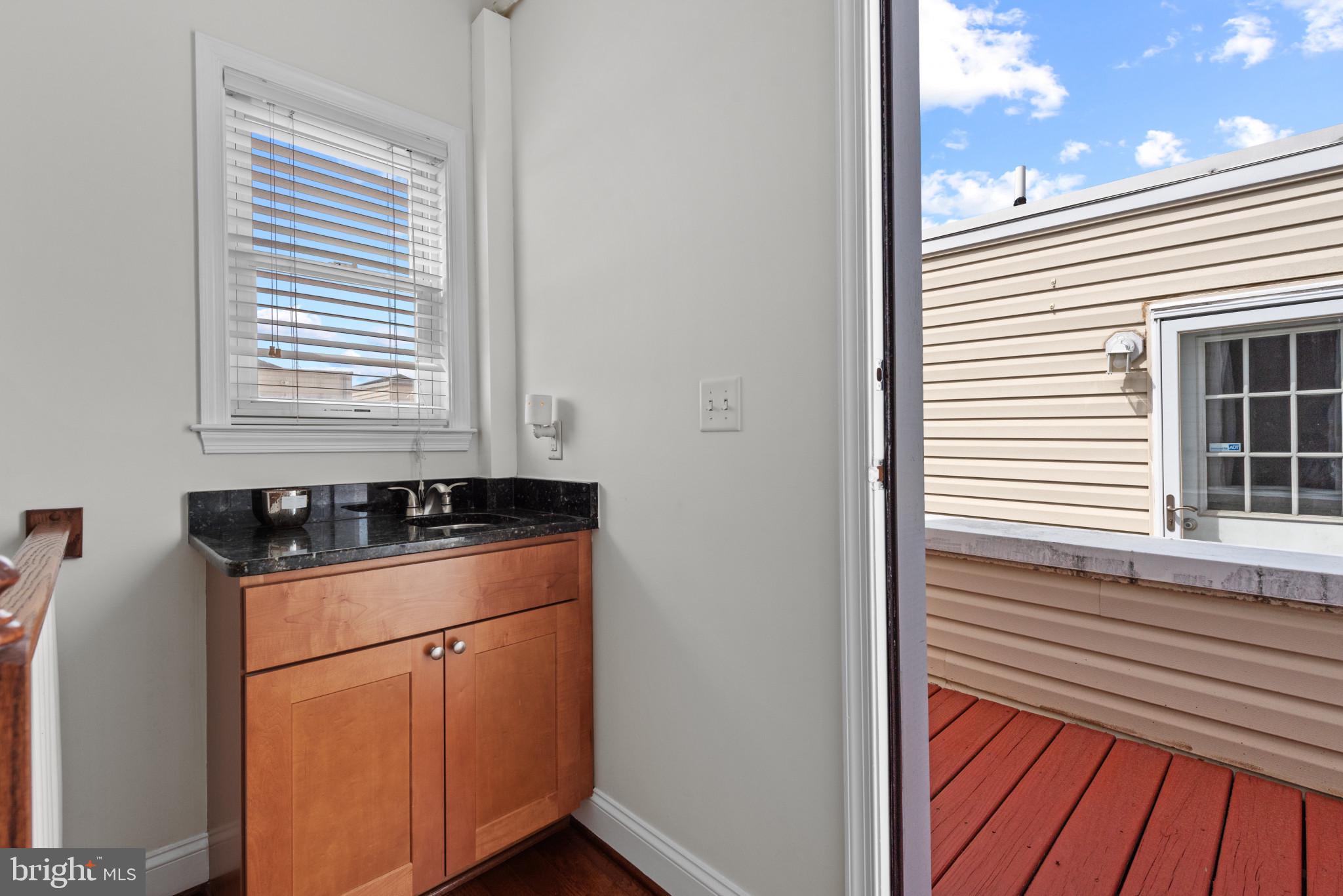 3418 Gunther Way Baltimore, MD 21224 - Photo 43 of 57 a kitchen with a sink and a window