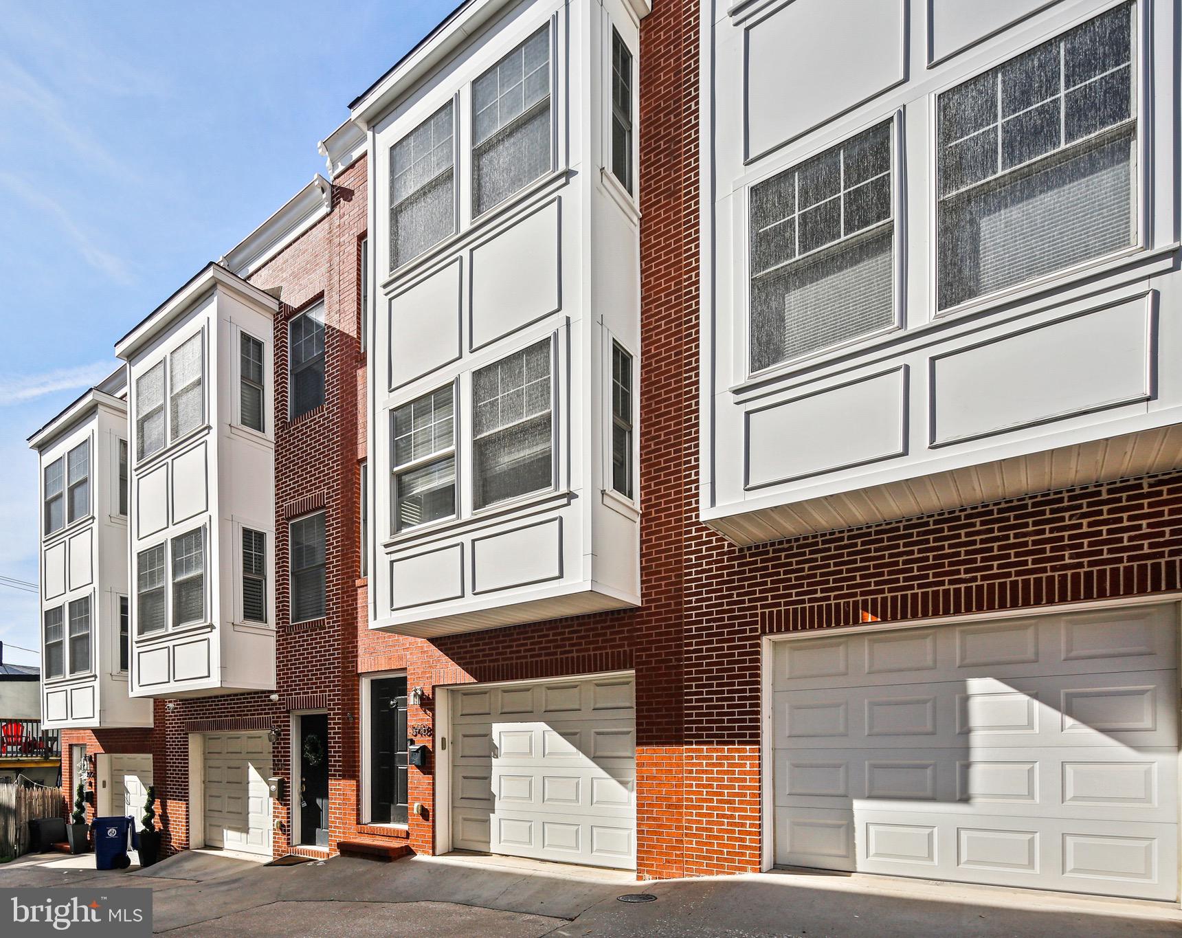 3418 Gunther Way Baltimore, MD 21224 - Photo 50 of 57 a front view of a building with a street