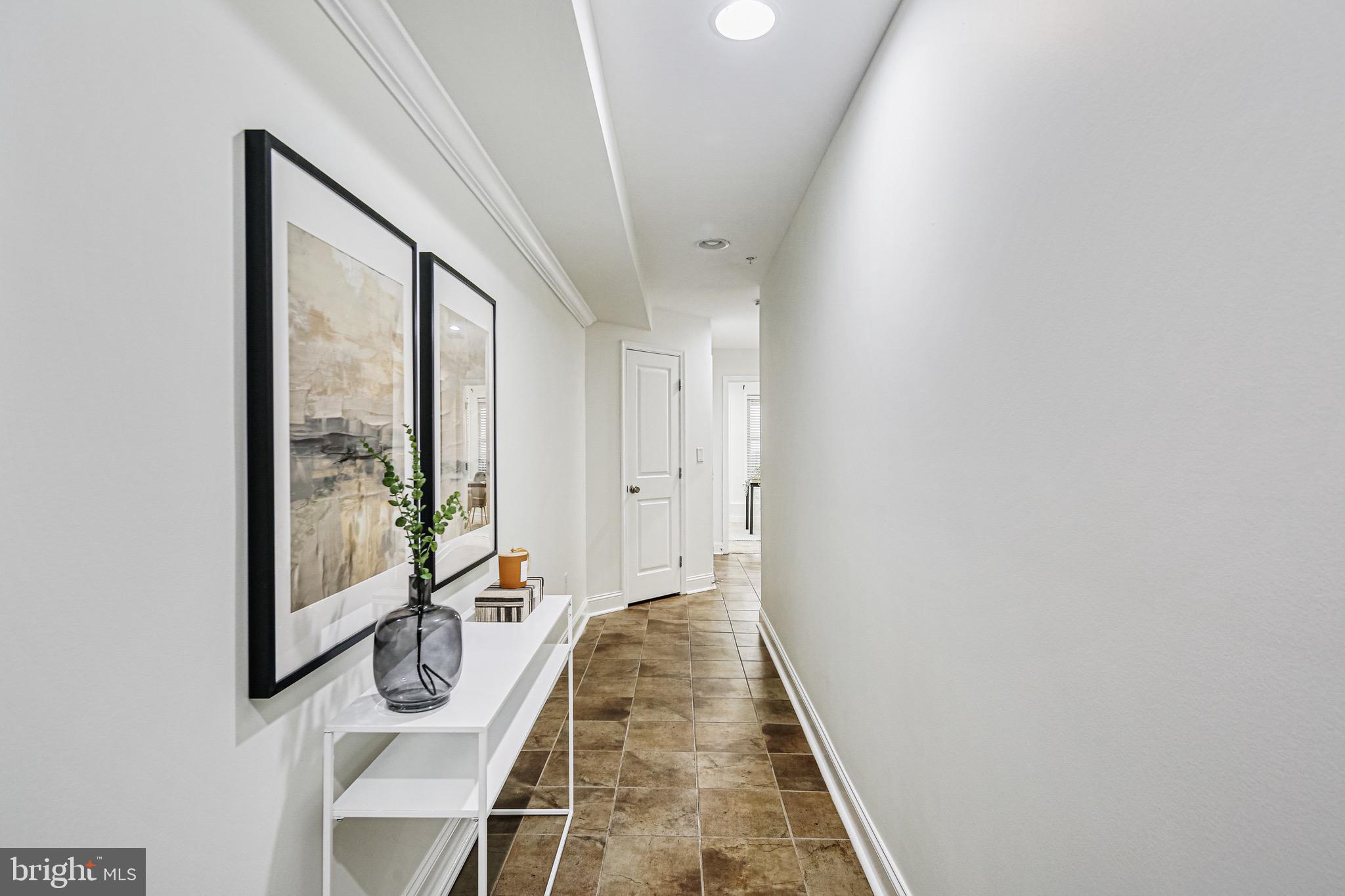 3418 Gunther Way Baltimore, MD 21224 - Photo 5 of 57 a view of a hallway with furniture and wooden floor
