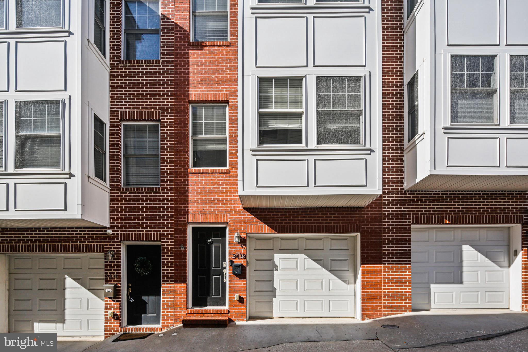 3418 Gunther Way Baltimore, MD 21224 - Photo 51 of 57 a front view of a multi story residential apartment building