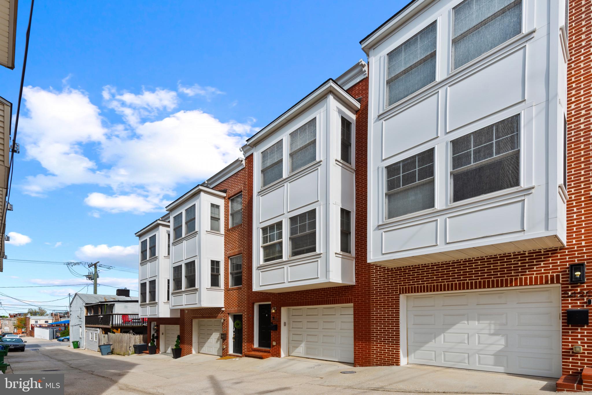 3418 Gunther Way Baltimore, MD 21224 - Photo 53 of 57 a front view of a building with a street