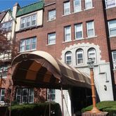 a front view of a building with balcony