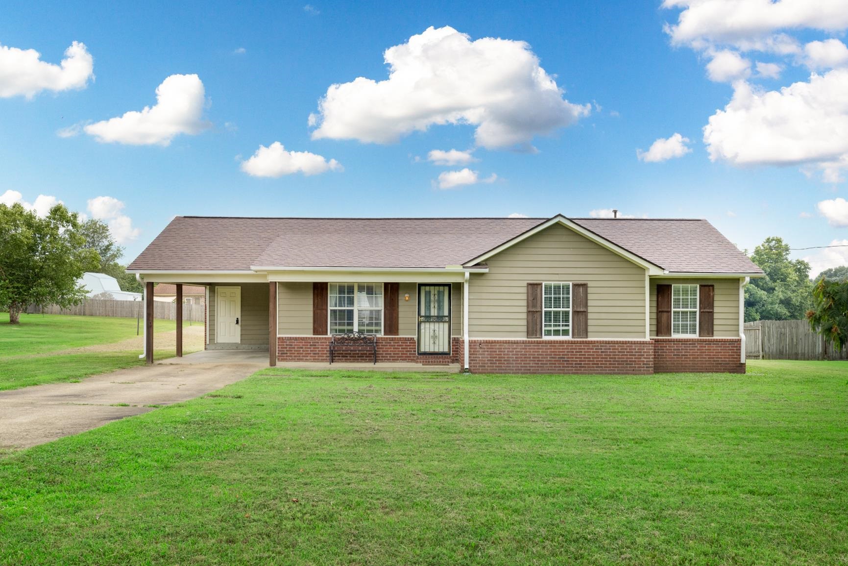 5305 Portersville Road Atoka, TN 38004 - Photo 1 of 20 Ranch-style home with a front lawn and a carport