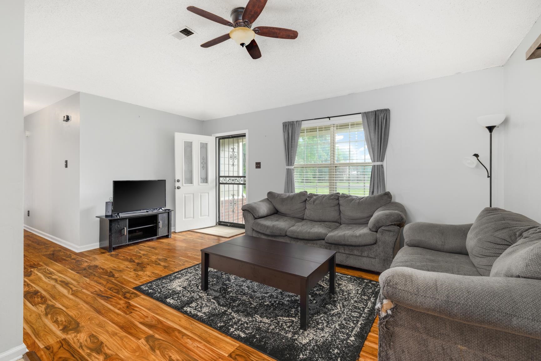 5305 Portersville Road Atoka, TN 38004 - Photo 3 of 20 Living room with wood-type flooring and ceiling fan